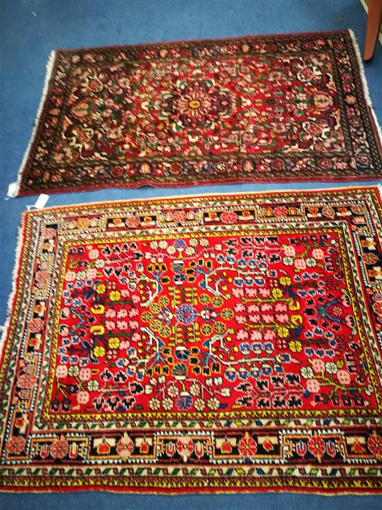 Two Persian red ground rugs W148cm x 105cm and 164cm x 105cm